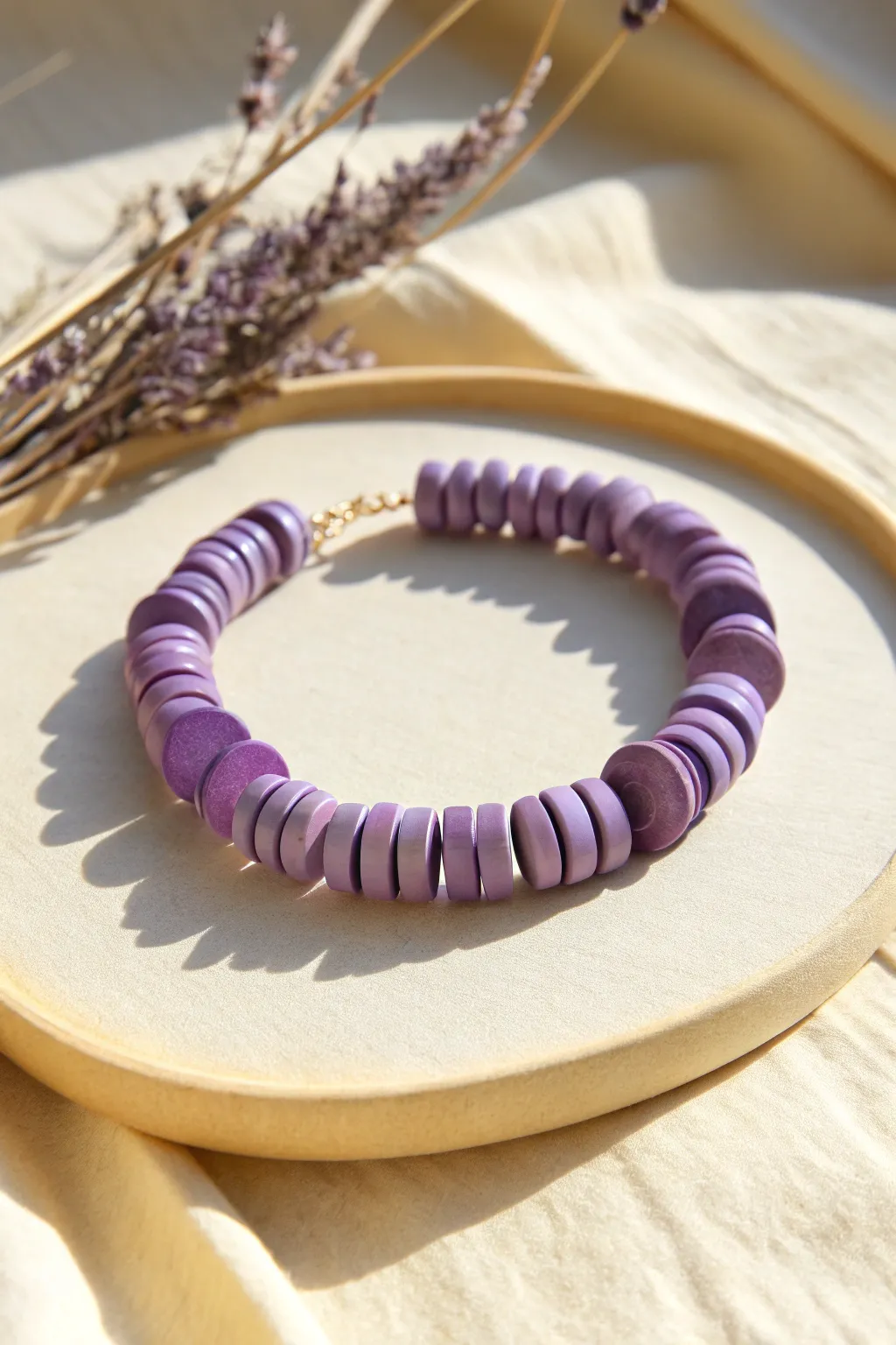 Matte lavender meets glossy deep purple for a striking alternating bracelet pattern.