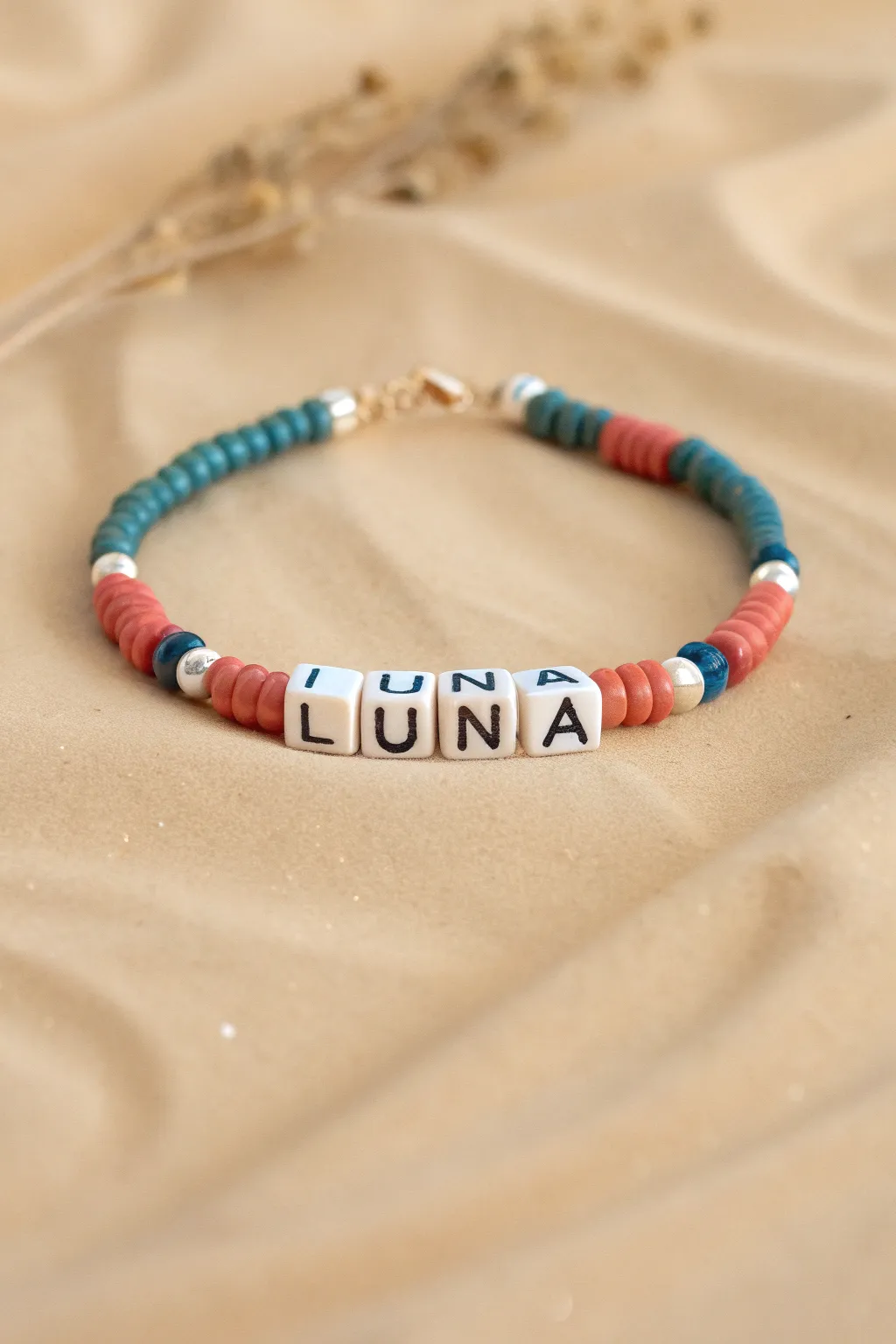 Minimal boho name bracelet with bold clay heishi beads and crisp letter beads, easy DIY inspo.