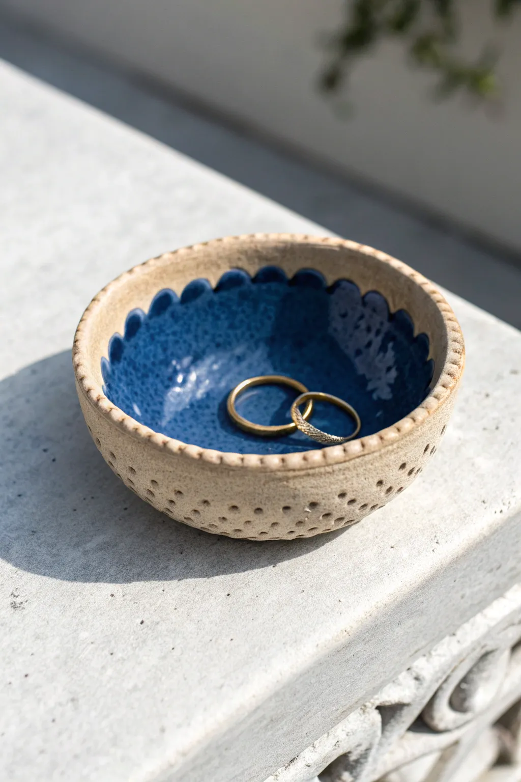 Beginner pinch-pot trinket dish with wavy rim and stamped texture, bold glaze pop