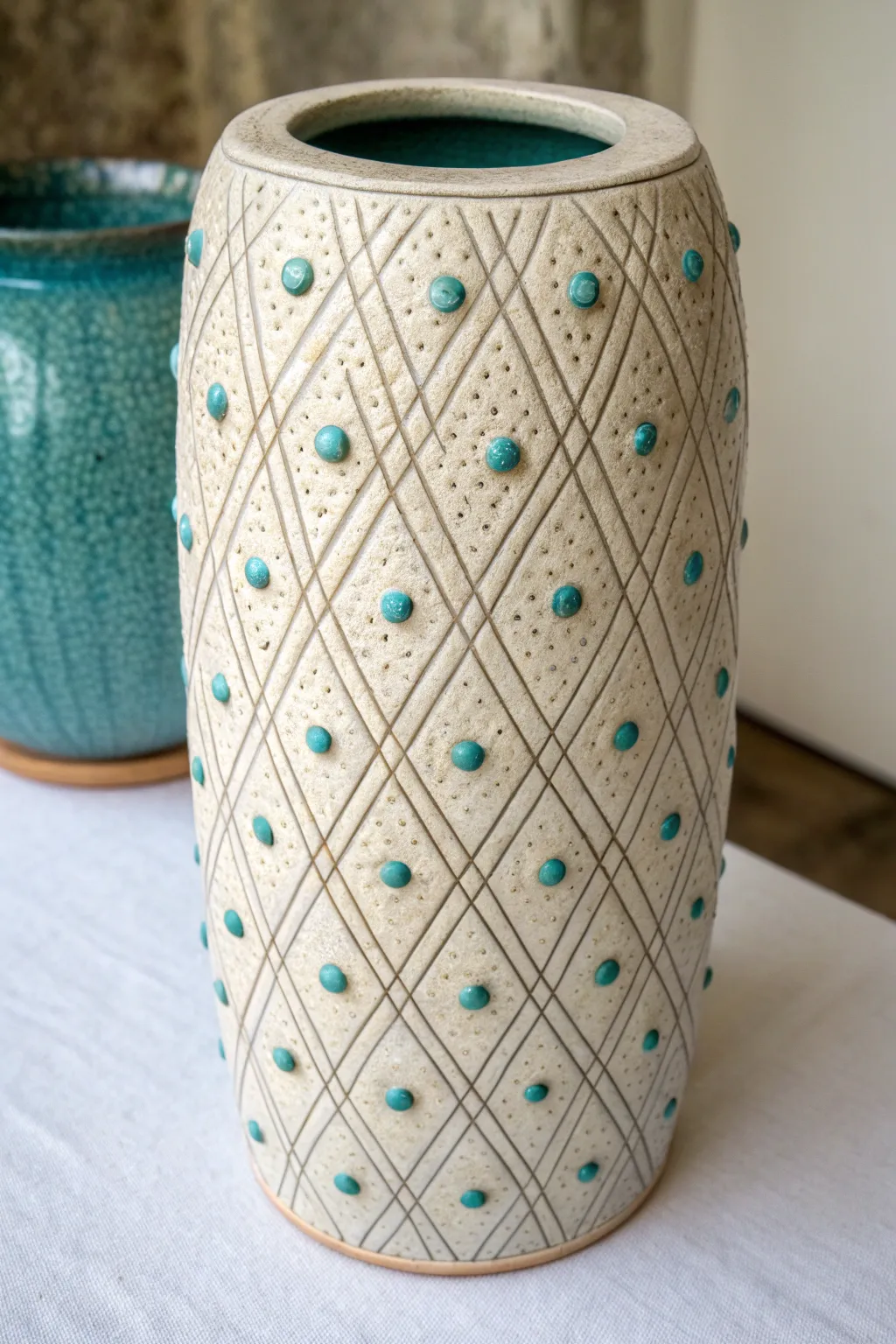 All-over stamped texture and a breaking teal glaze make this slab vase pattern pop in minimalist style.