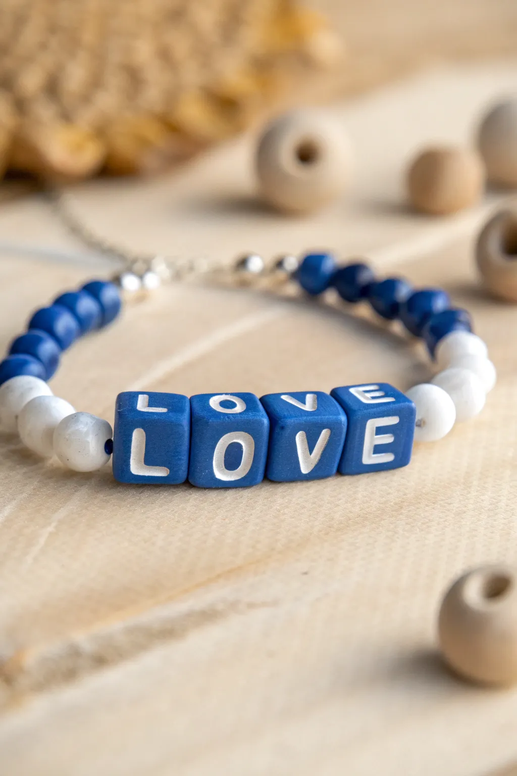 Mini polymer clay alphabet beads in bold color, styled simply for sweet minimalist bracelets.