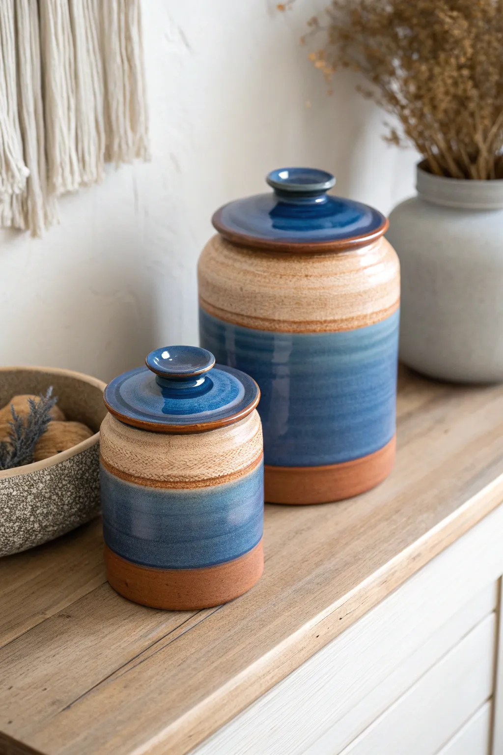 Wheel-thrown sugar bowl and canister duo in bold glaze for a chic minimalist shelf moment.