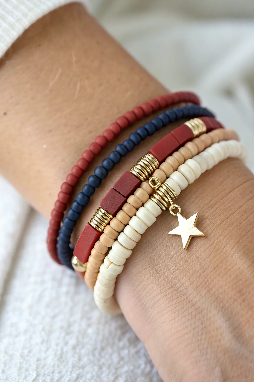 Minimal heishi stack in red, ivory, and navy, finished with a sweet star charm drop for July 4