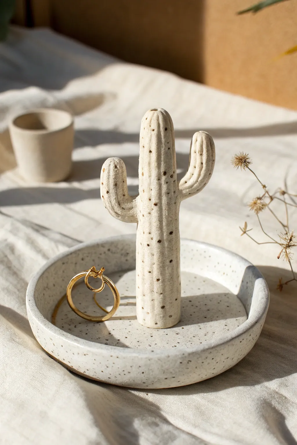 Minimal clay cactus ring holder with base dish, a sweet bakeable DIY for tidy jewelry.