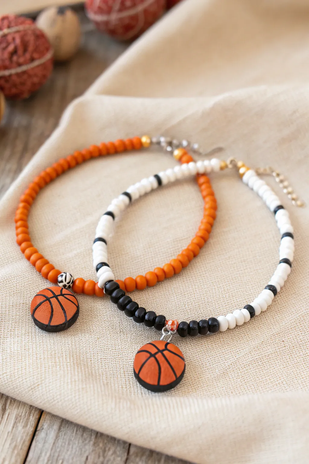 Two matching basketball clay bead bracelets with tiny ball charms, a sweet split set for best friends