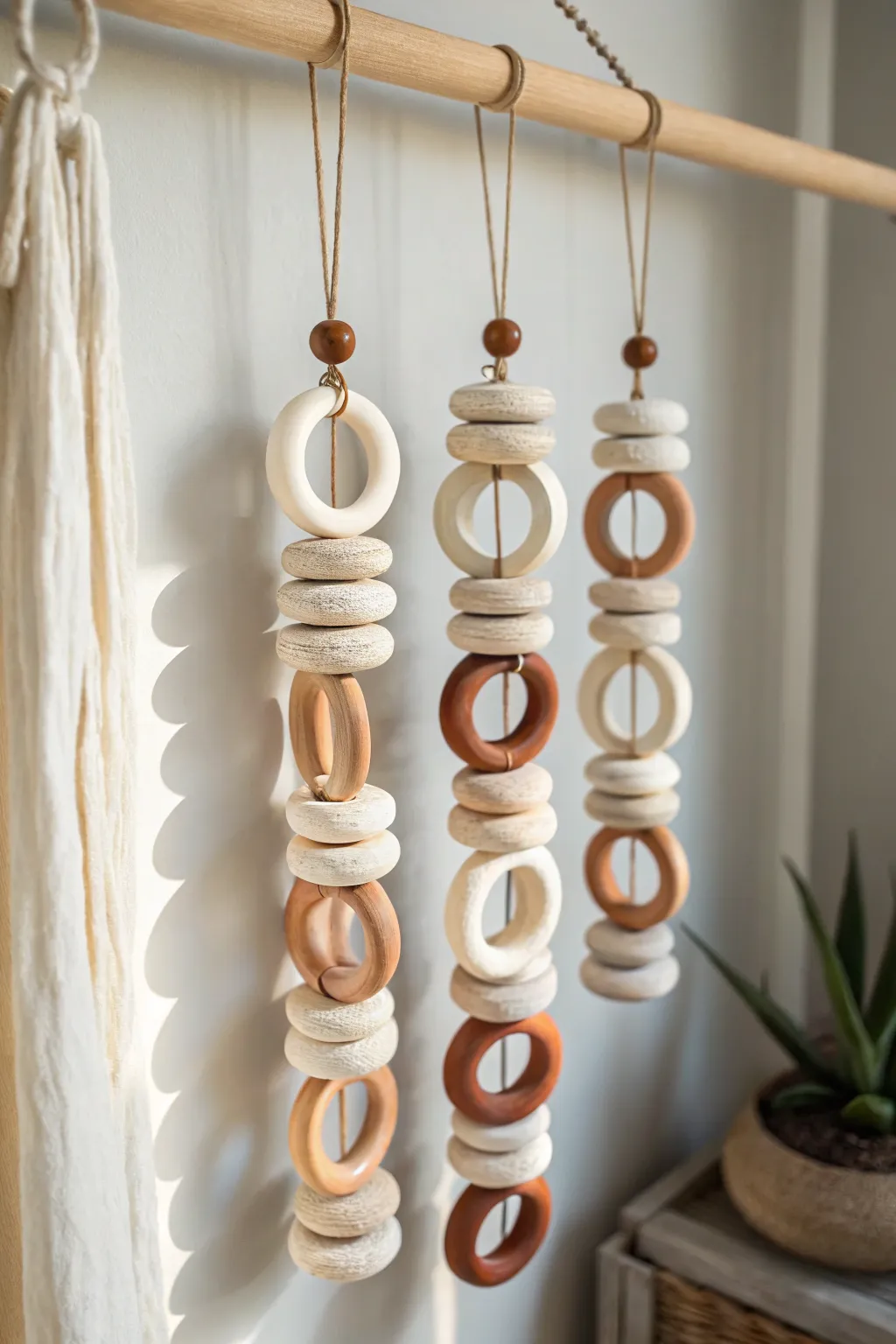 Organic clay ring wall hanging in soft neutrals, minimalist Scandinavian style with boho warmth