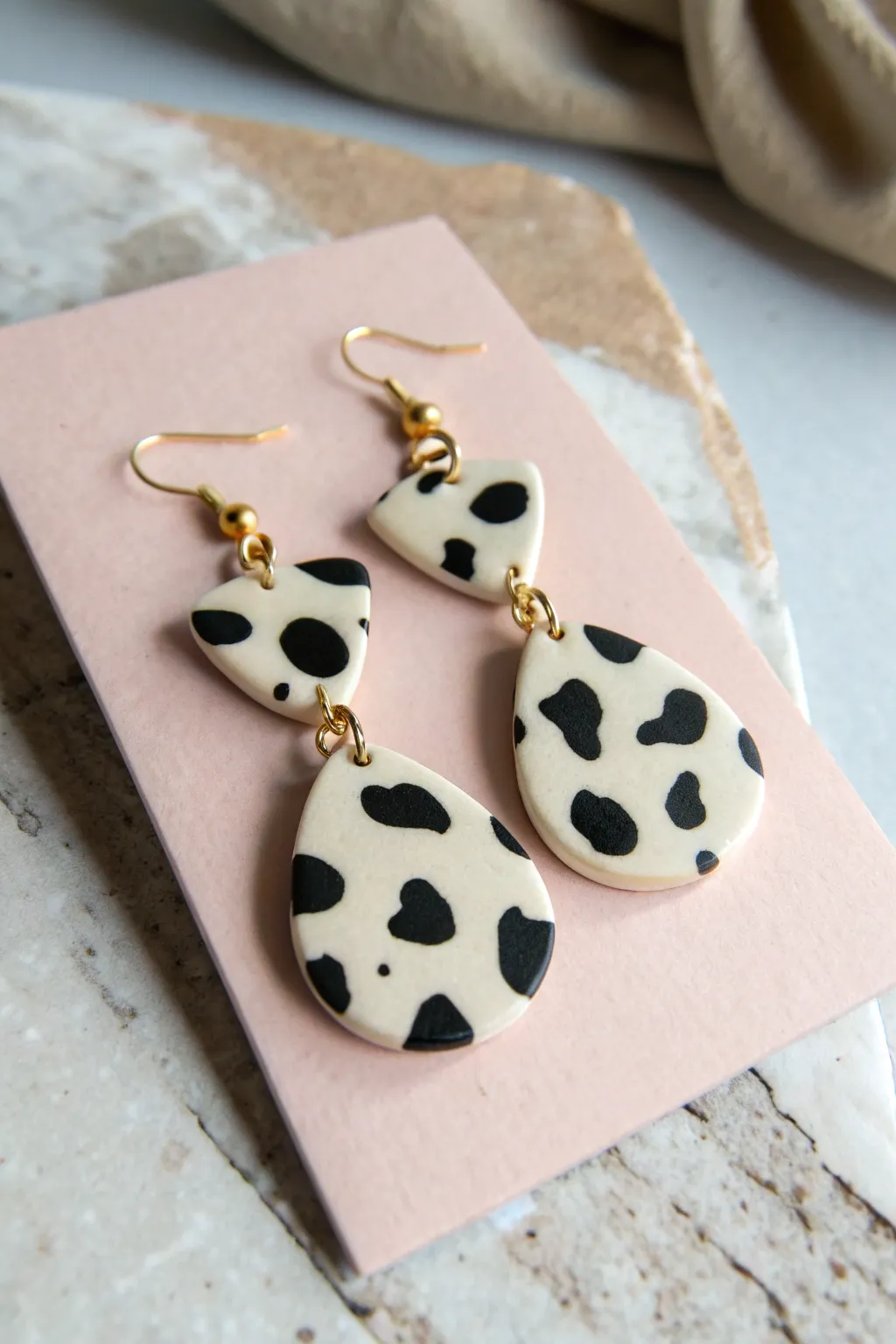 Beginner-friendly cow-print clay dangles with a clean two-piece design and modern minimal vibe.