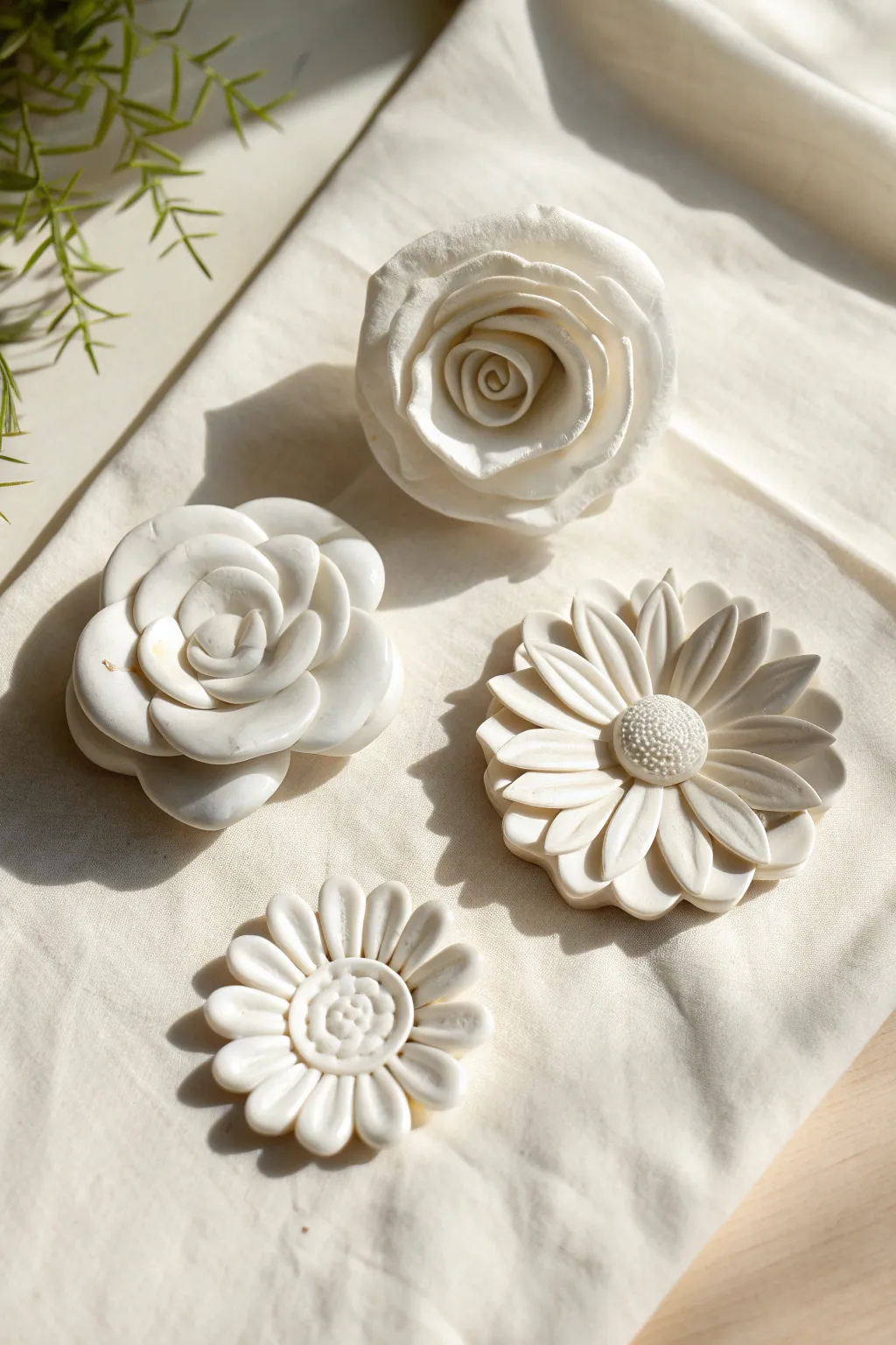 Monochrome white clay flowers with crisp shadows for a clean, sculptural minimalist look.