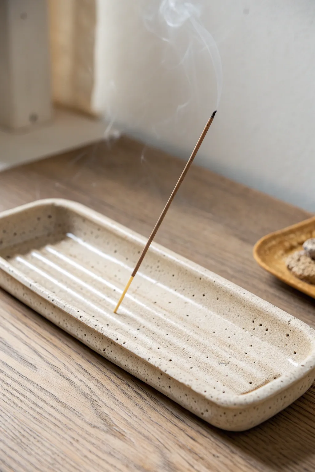 Minimal clay incense tray with built-in ash channel, calm neutrals, handmade simplicity.
