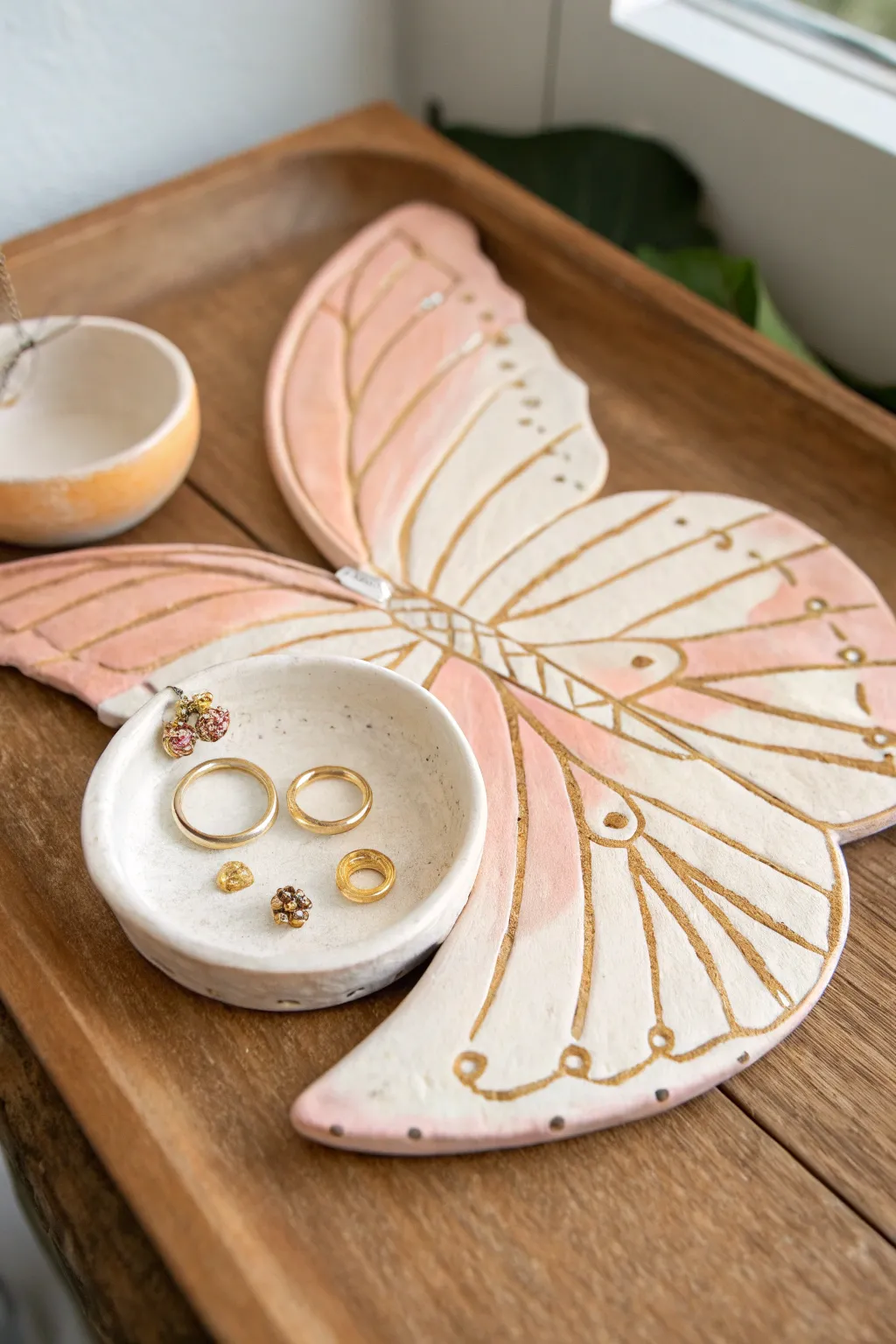 Butterfly wing clay dish with earring holes and a ring tray in soft pastels, minimal and chic