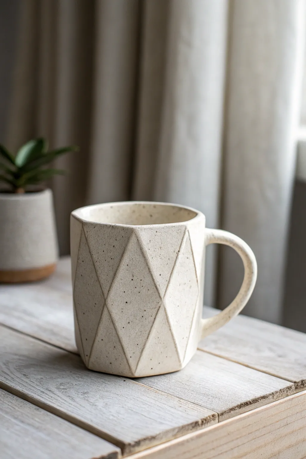Faceted slab mug with crisp angled panels, minimal matte glaze and cozy Scandinavian calm.
