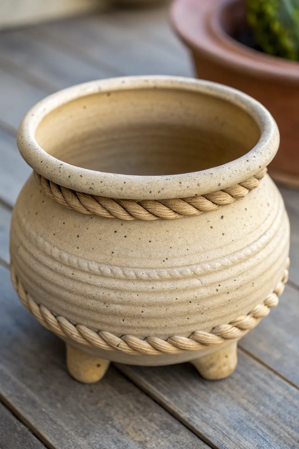 Corrugated coil pinch pot with a cozy cauldron shape, rugged texture, and soft Nordic light.