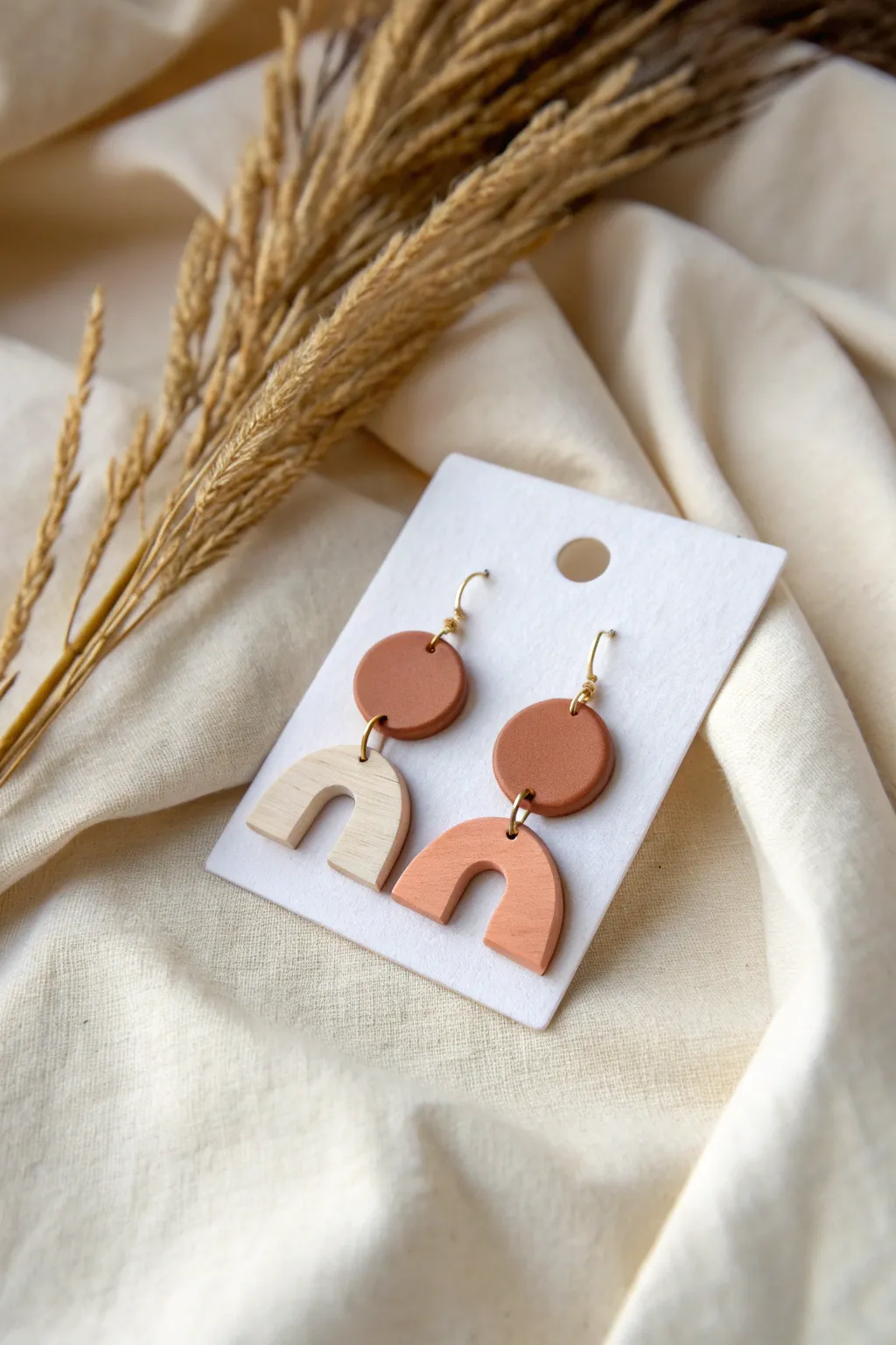 Minimal geometric polymer clay earrings with a matte finish, styled for a chic boutique vibe.