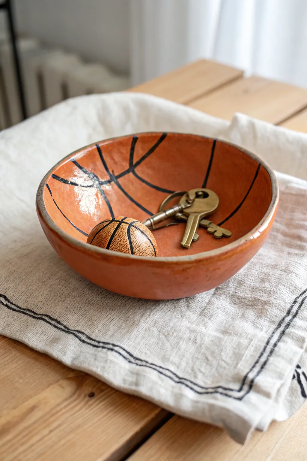 Simple clay sports ball trinket bowl, a cozy Fathers Day gift idea that keeps keys in one place.