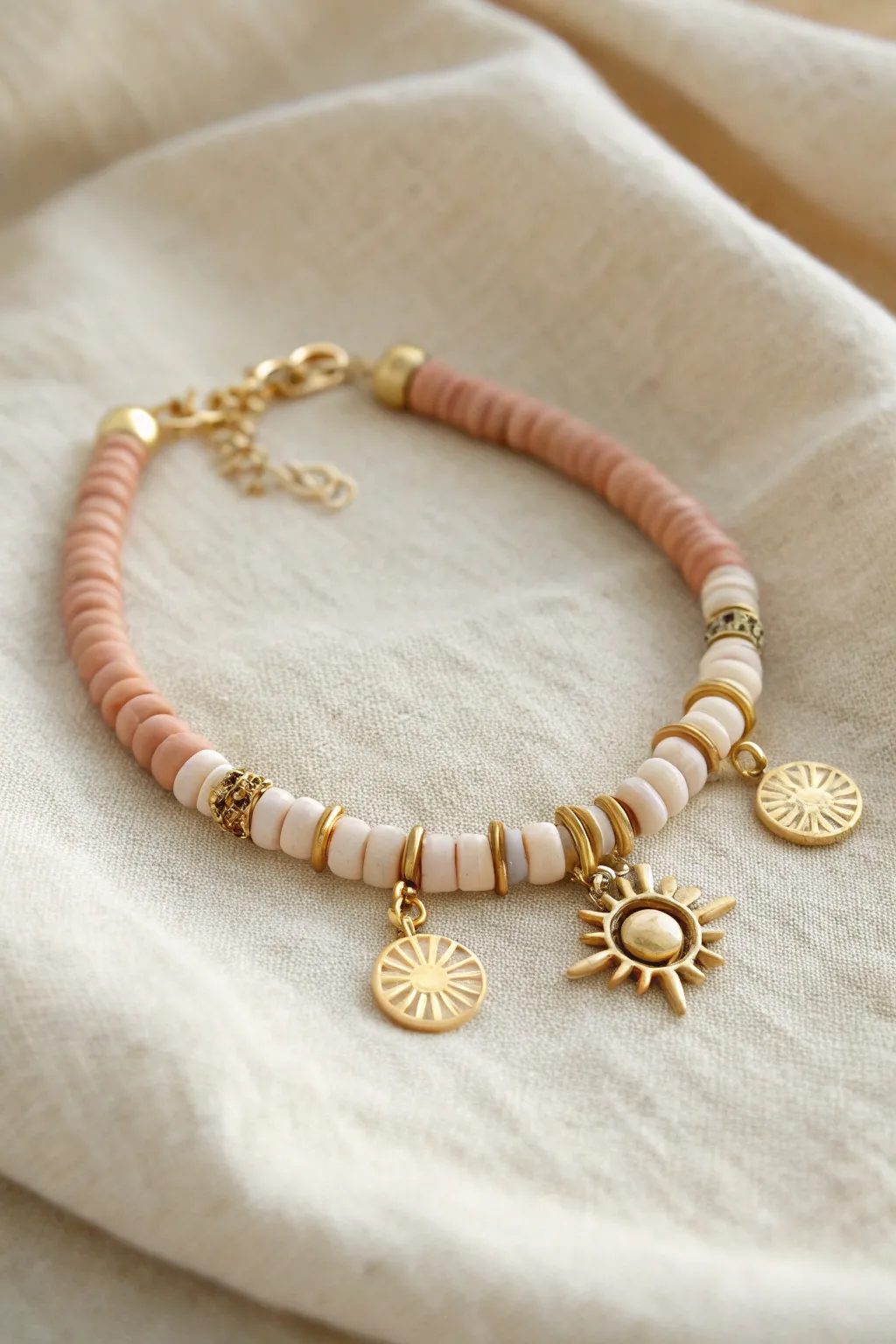 Charm cluster heishi bracelet with balanced color blocks and a simple statement center