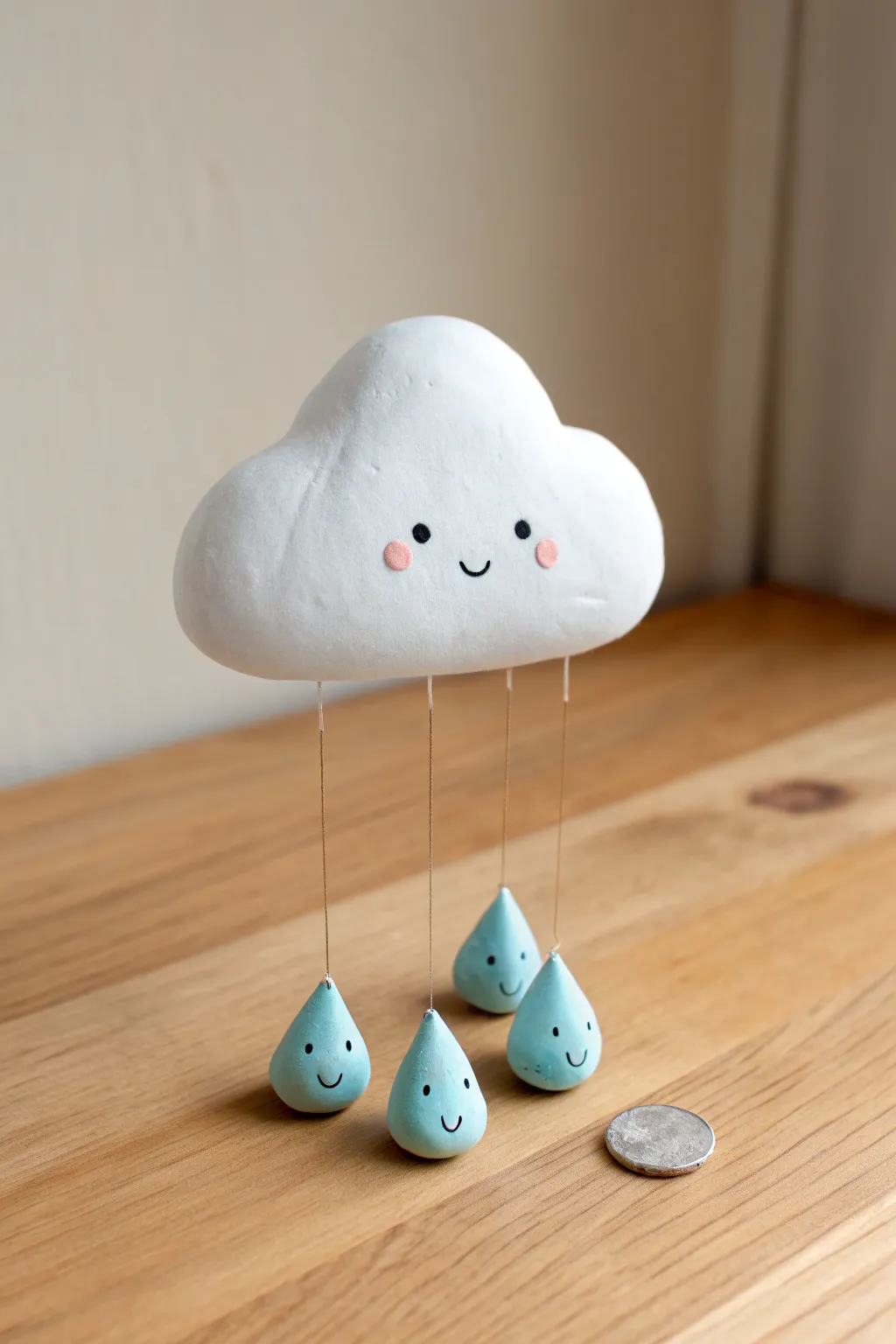 Sweet mini clay cloud with dangling raindrop friends, minimalist Scandinavian charm