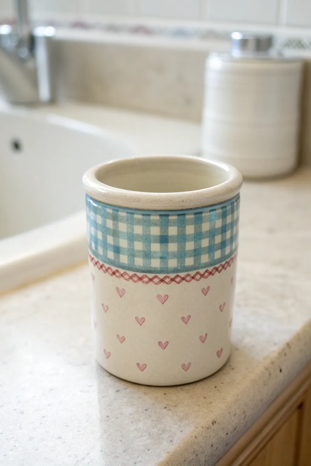 Minimal ceramic toothbrush cup with a preppy patterned band, bright and clean Scandinavian styling.