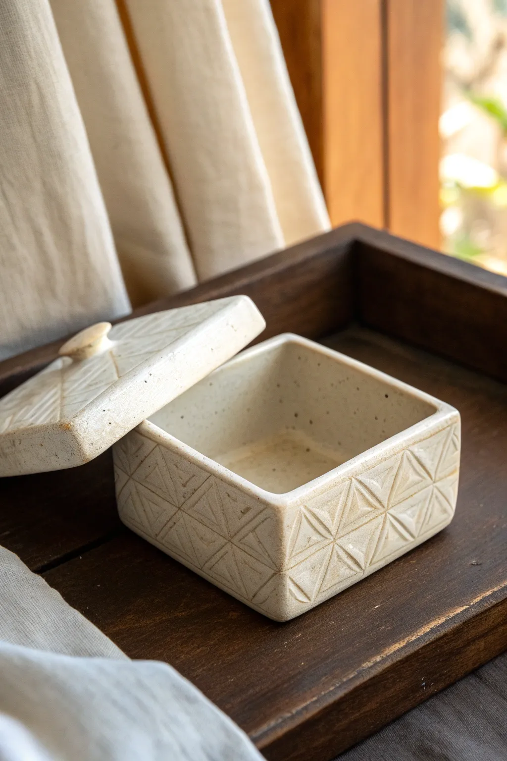 Minimalist keepsake slab box with fitted lid and soft embossing, slightly ajar for a peek inside.