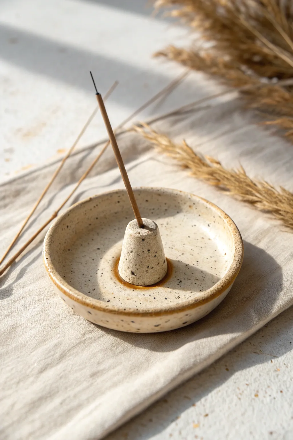 Minimal clay incense holder dish with subtle texture, calm boho accents, perfect small art idea.
