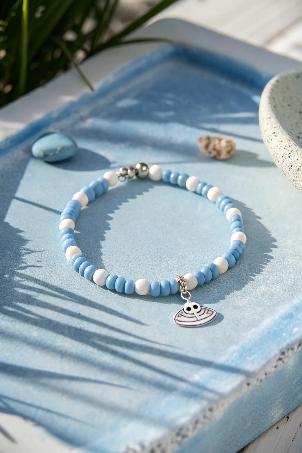 Blue and white heishi bracelet with a tiny alien charm, minimal and sweet Stitch-inspired style