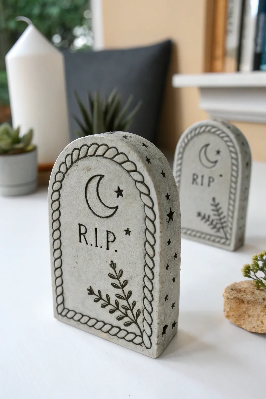 Minimal Halloween table with tiny air-dry clay tombstone markers, cute, handmade, and chic.
