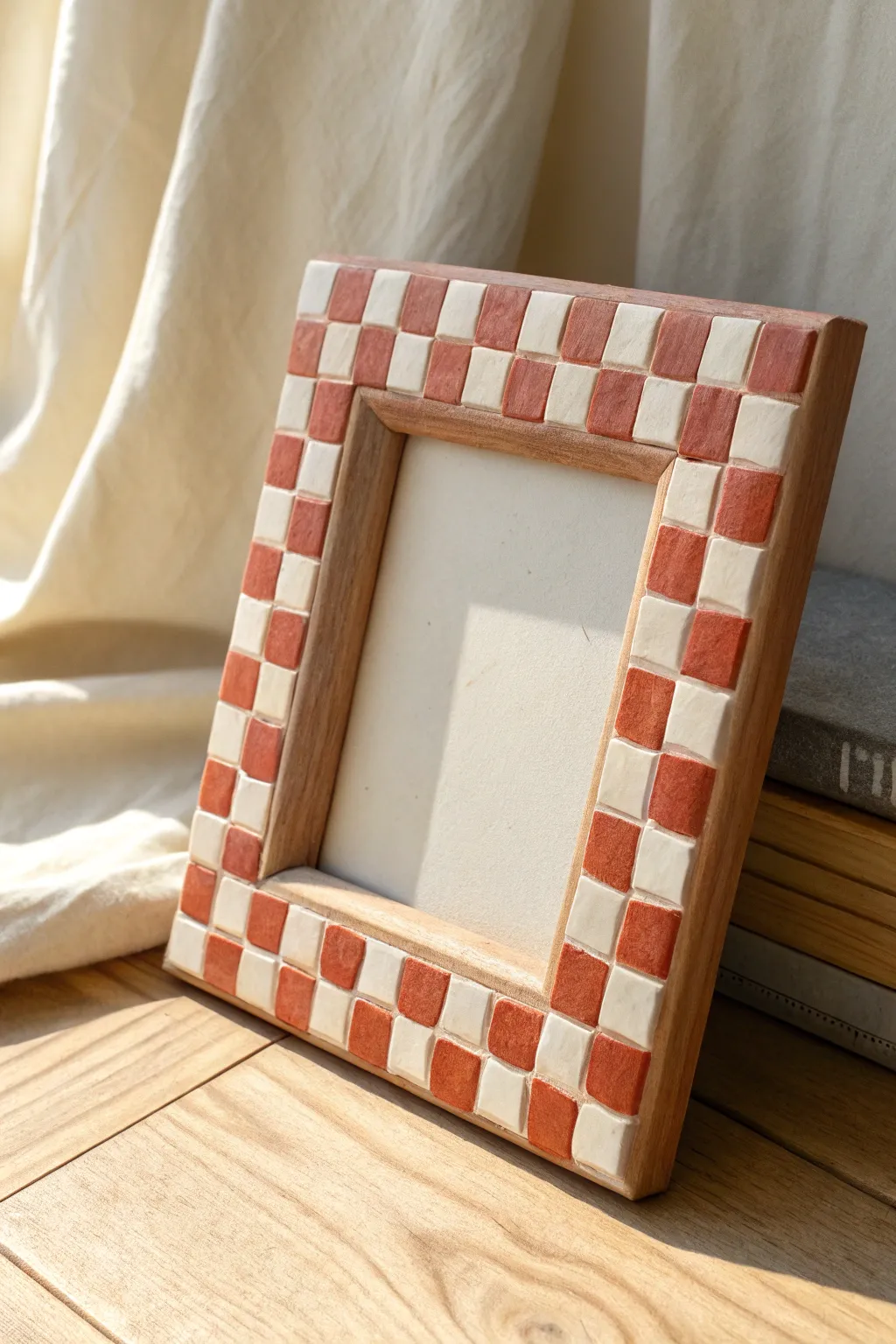 Bold checkerboard color-block air dry clay frame in terracotta and ivory, minimal boho style.