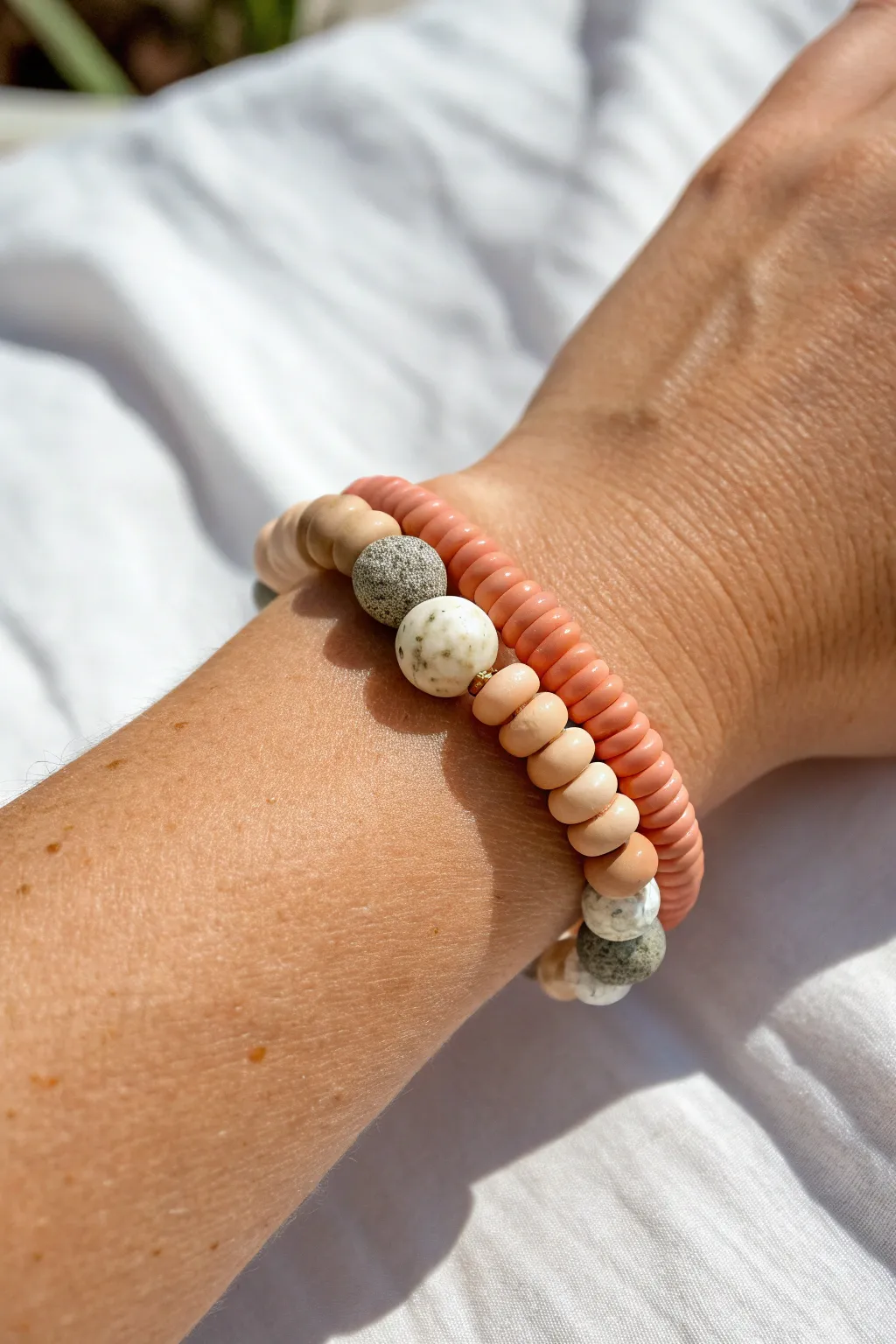 Chunky stone spacers add a modern boho twist to simple heishi clay bead bracelets.
