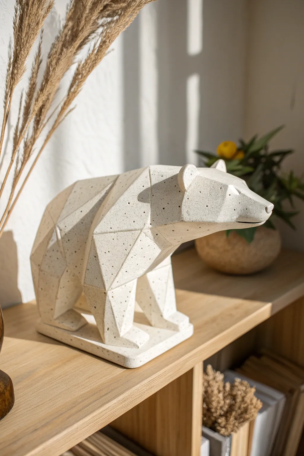 Minimal geometric ceramic bear in matte white, styled with airy Scandinavian calm and soft contrast