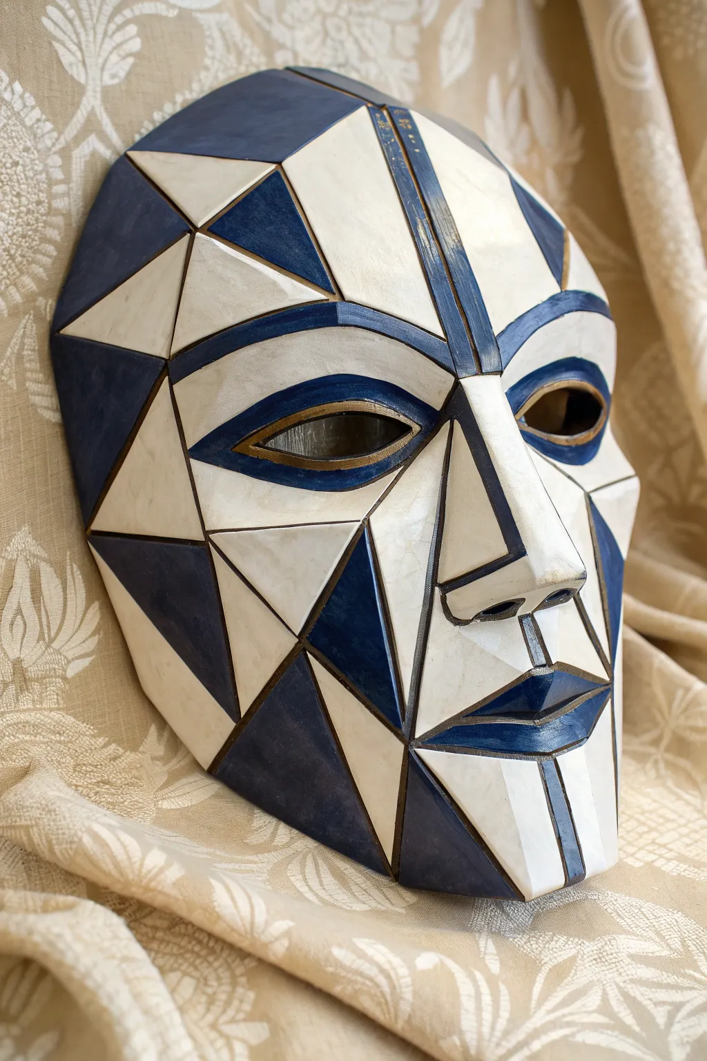 Geometric cubist ceramic mask in bold two tone glaze, minimalist yet artful wall decor.
