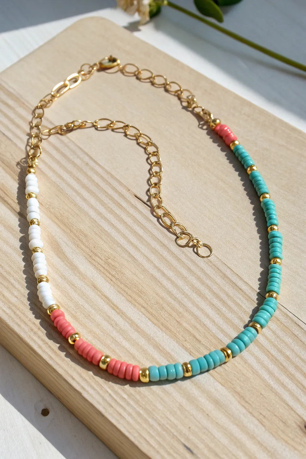 Summer half chain, half clay heishi necklace with bright beads for an easy statement look.