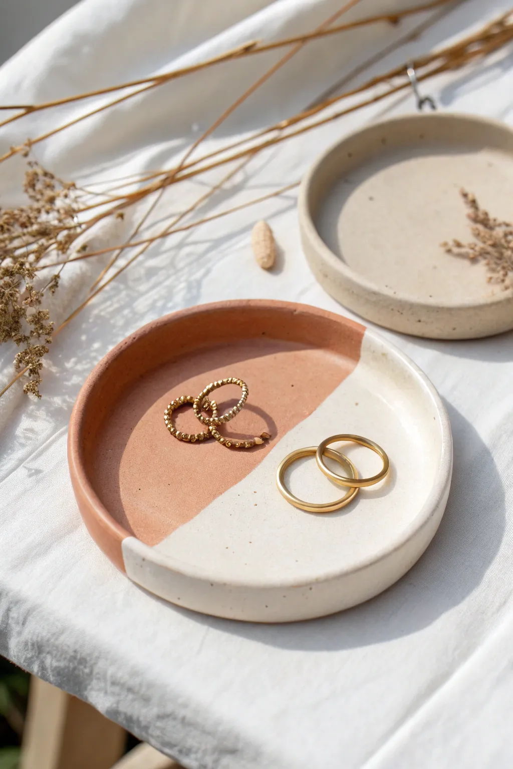 Modern two-tone clay jewelry dish with crisp color blocking and a soft minimalist vibe