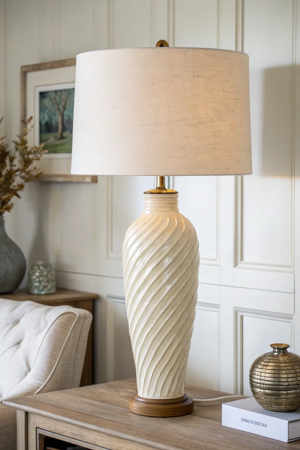Glossy rippled clay lamp base catching soft daylight, minimal Scandinavian style with a boho touch