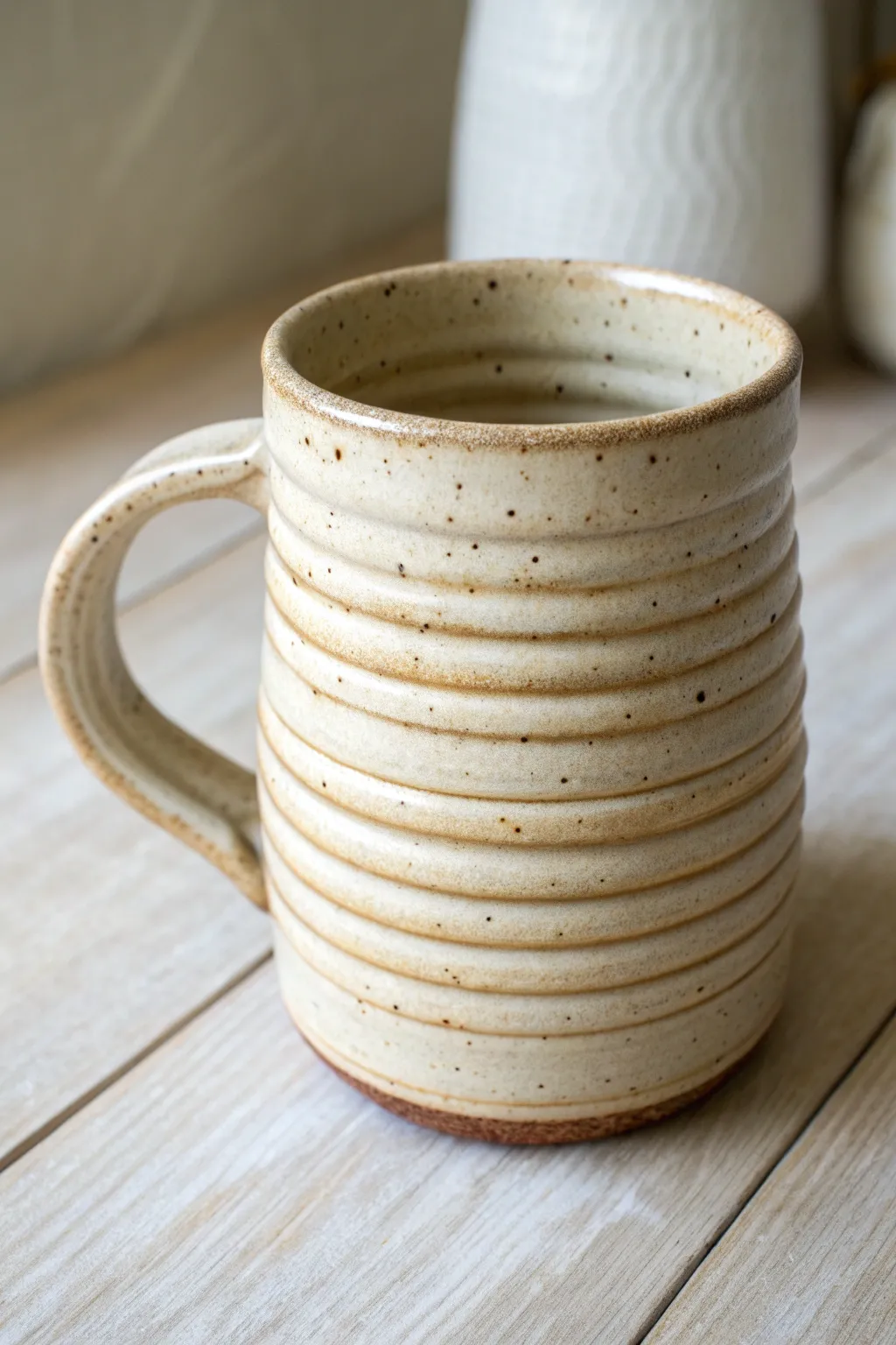 Slip-brushed grooves make this coil mug pop—simple, earthy, and beautifully handmade.