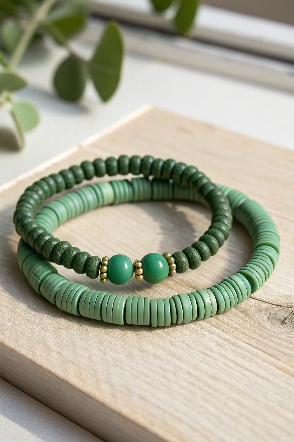 Matte and gloss green heishi bracelets paired for a subtle texture contrast and boho calm.