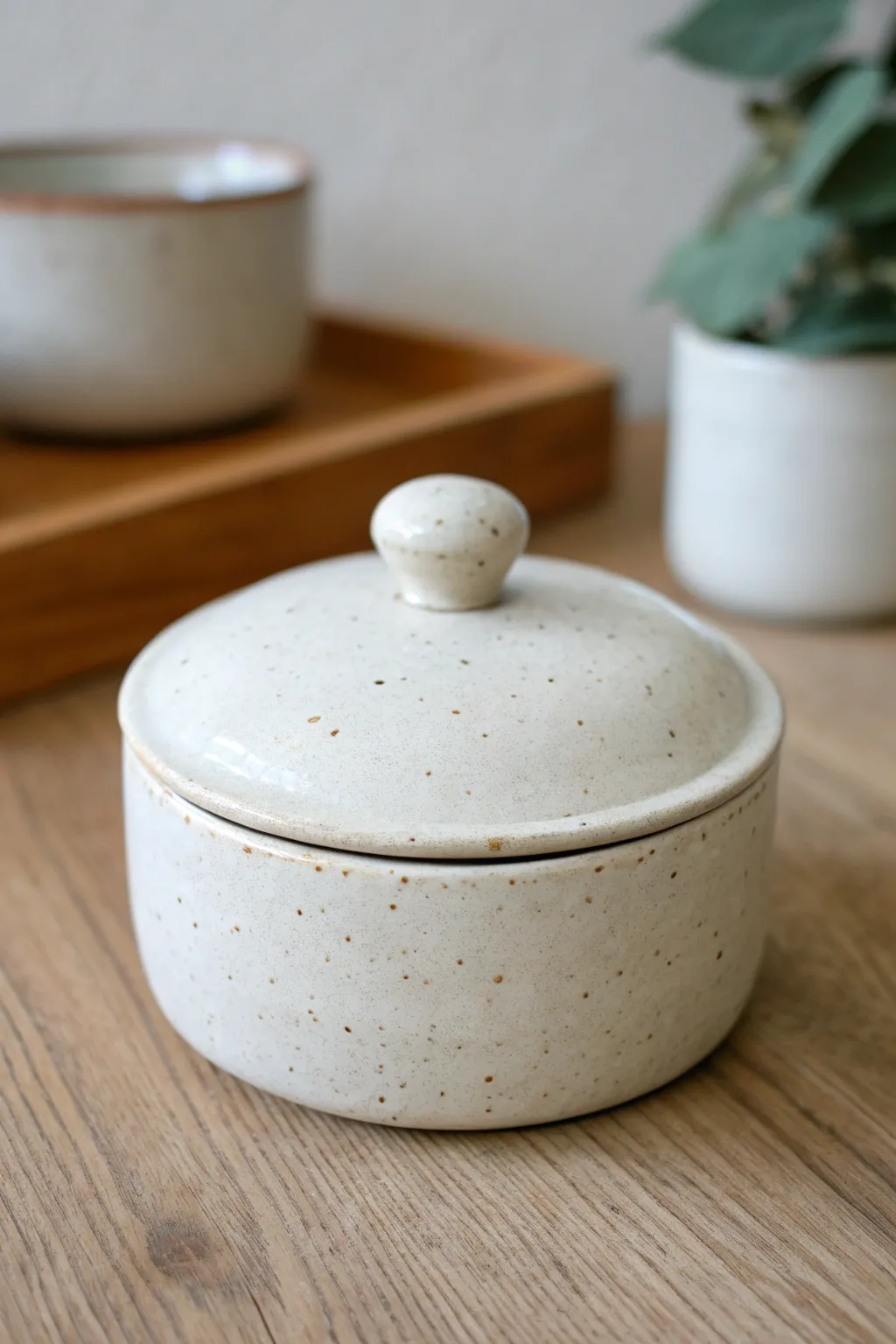 Minimal lidded pinch pot box, slightly open to show the fit and handmade detail