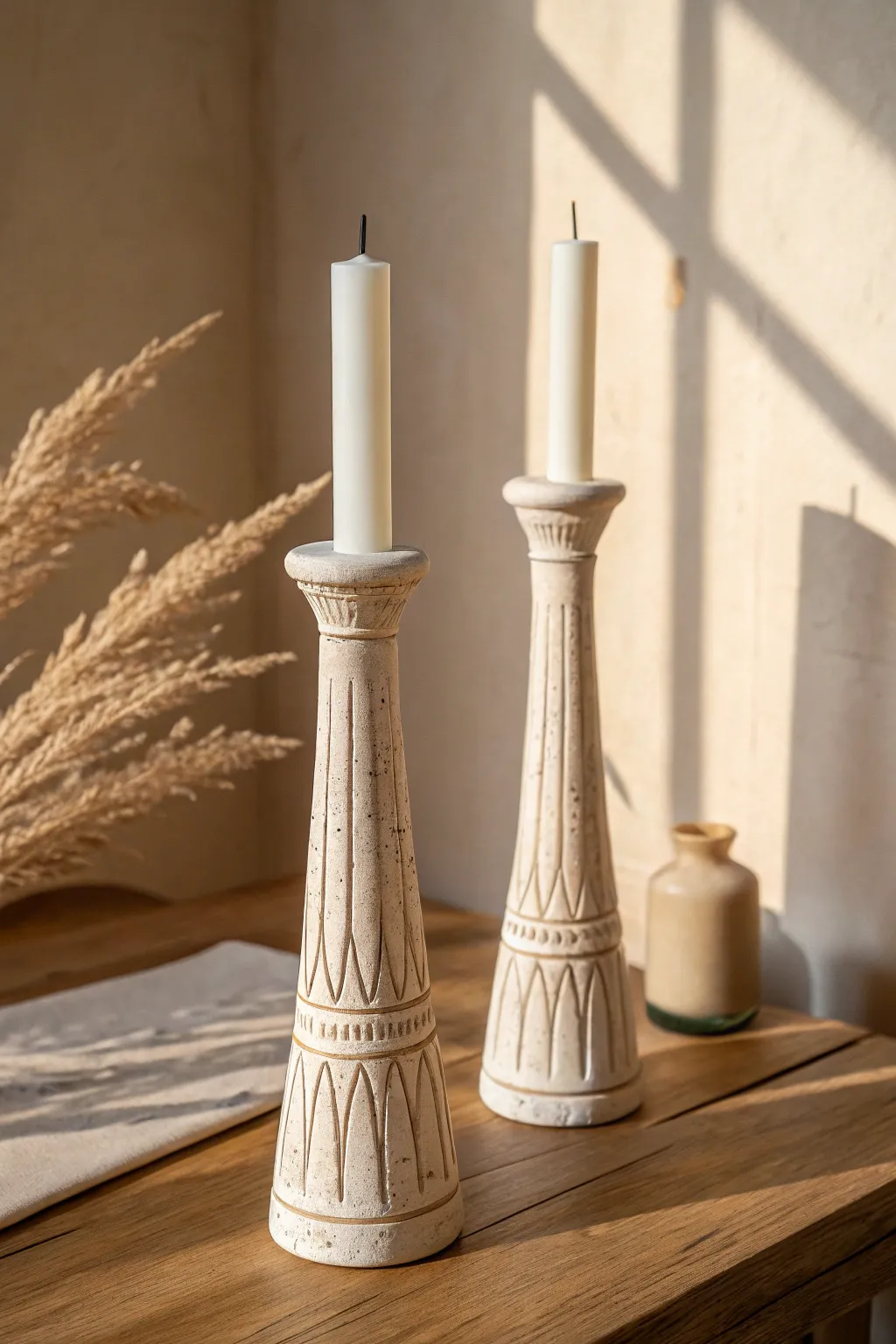 Modern handmade clay candle holders with carved lines, minimalist warmth and soft boho calm.