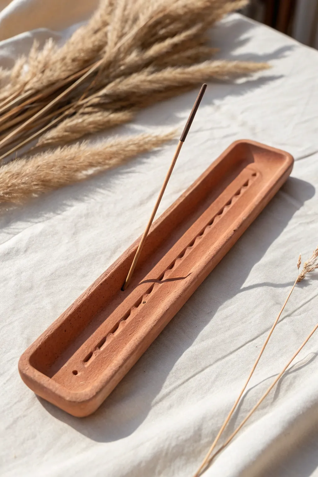Monochrome clay incense holder with clean cut lines, minimal styling and warm Scandinavian calm.