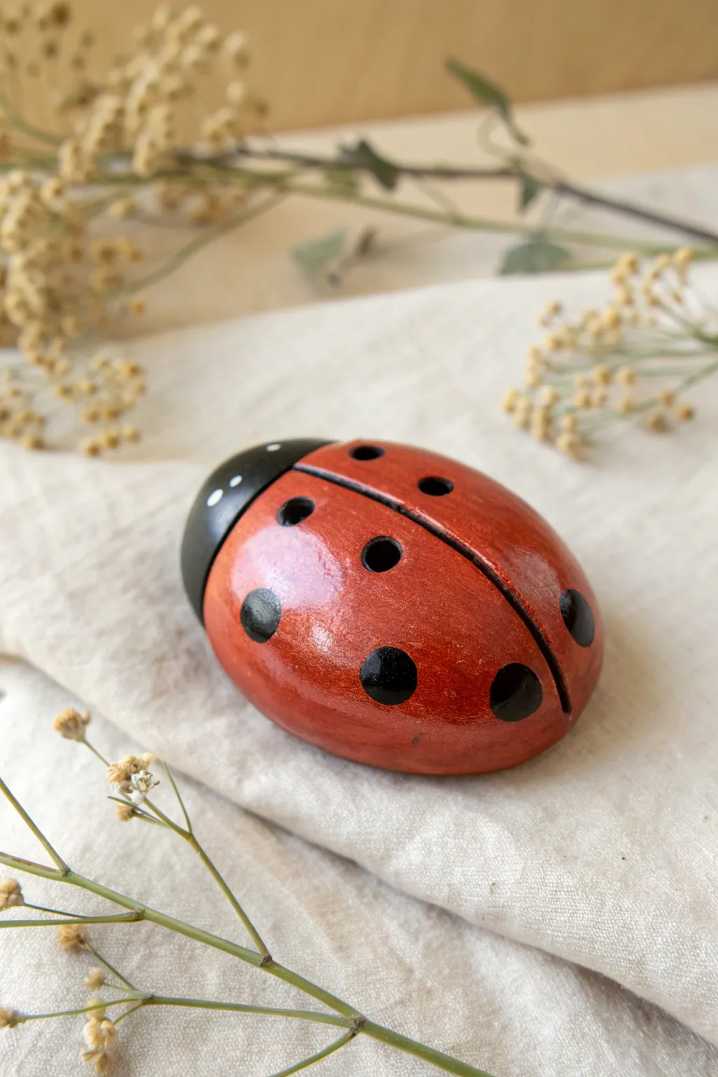 Minimalist ladybug clay whistle with bold spot finger holes, high contrast and handmade charm