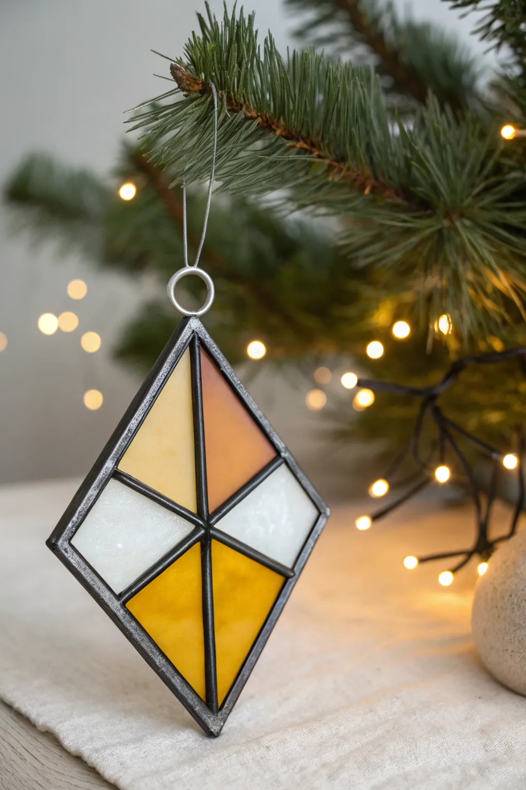 DIY polymer clay faux stained glass ornament with bold lines, glowing colors, minimalist boho charm