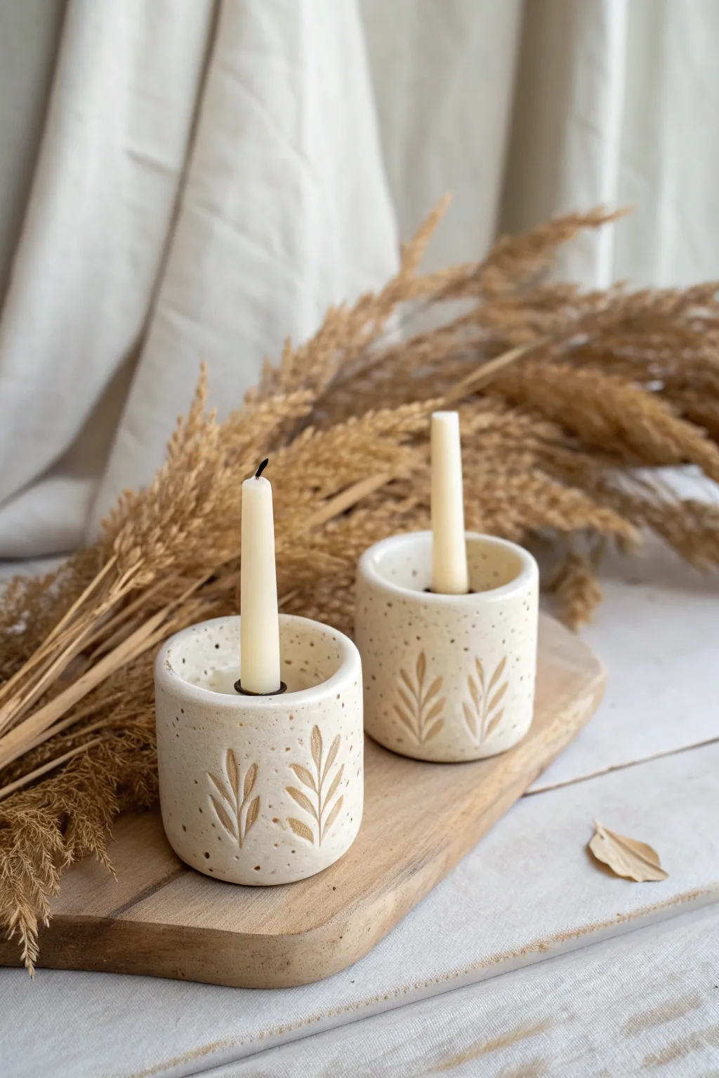 Pressed-botanical ceramic candle holders for a calm, cozy minimal-boho pottery look
