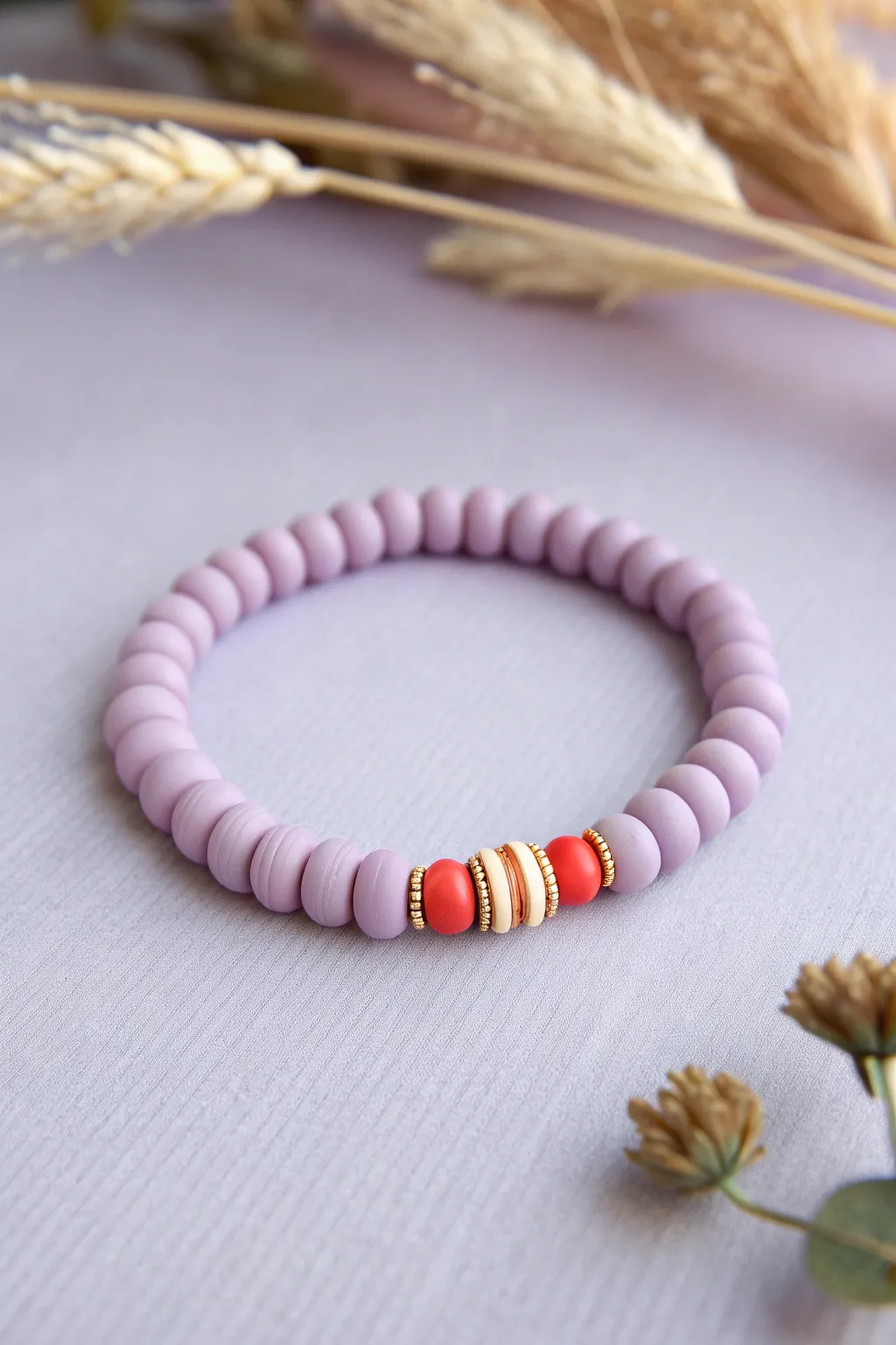 Lavender clay bead bracelet with one bold stripe and gold spacers for a clean preppy look