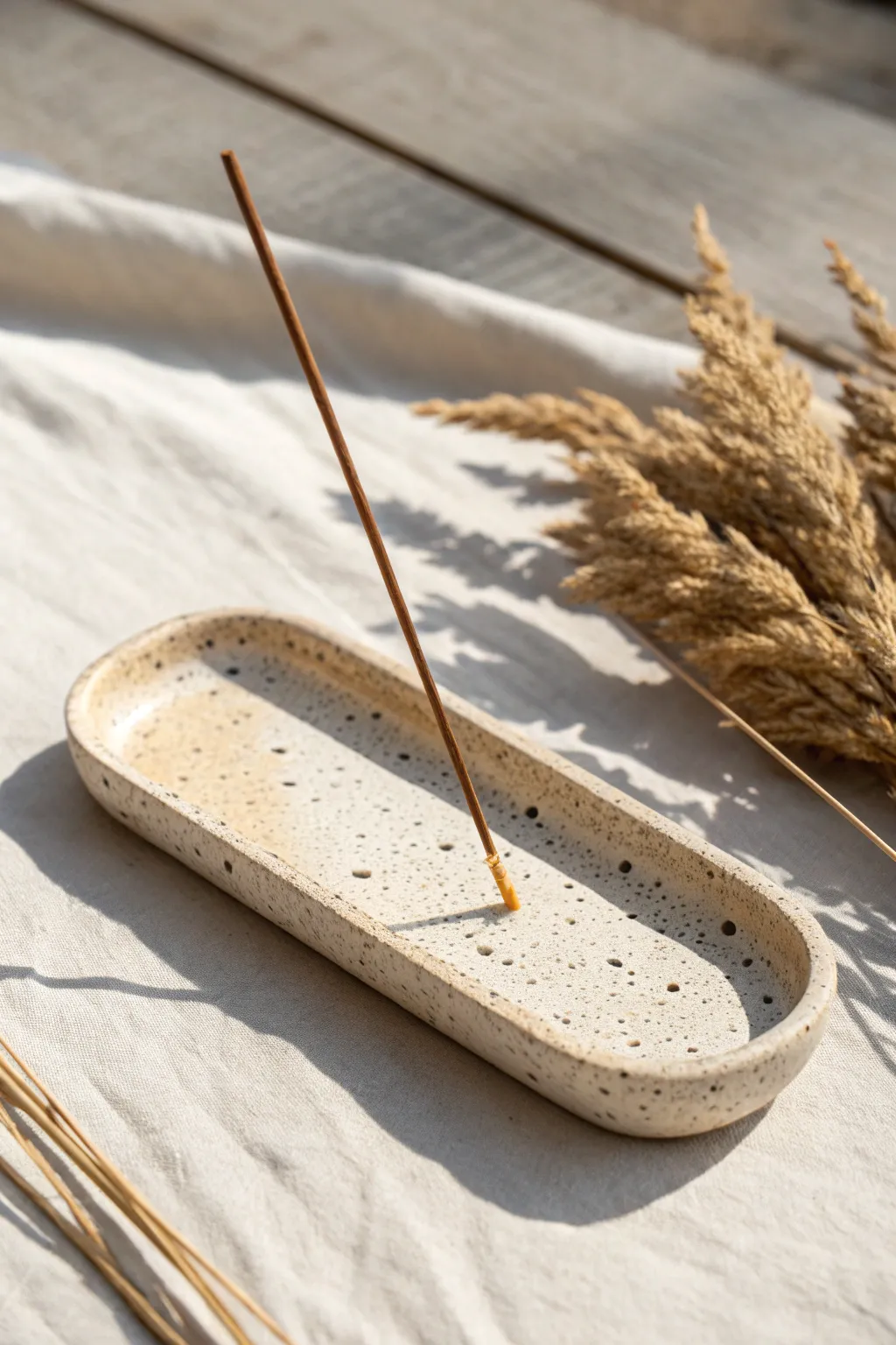 Minimal speckled clay incense holder with a calm groove design, perfect for small DIY projects