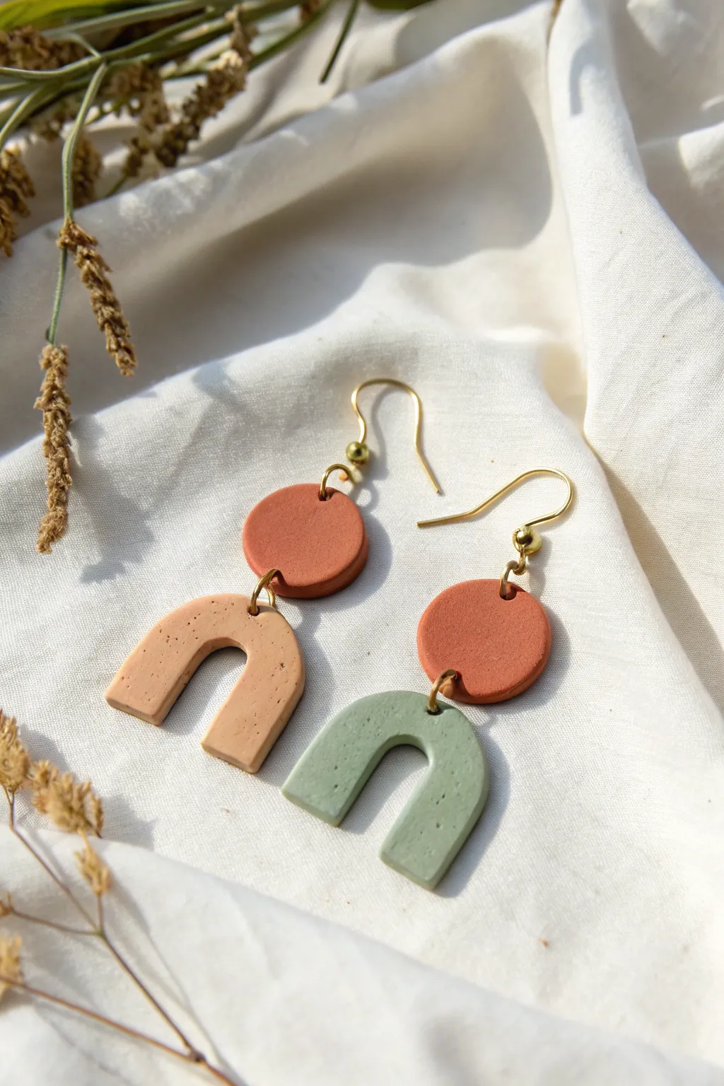 Minimal geometric air dry clay earrings in muted tones, perfect for a simple boho look