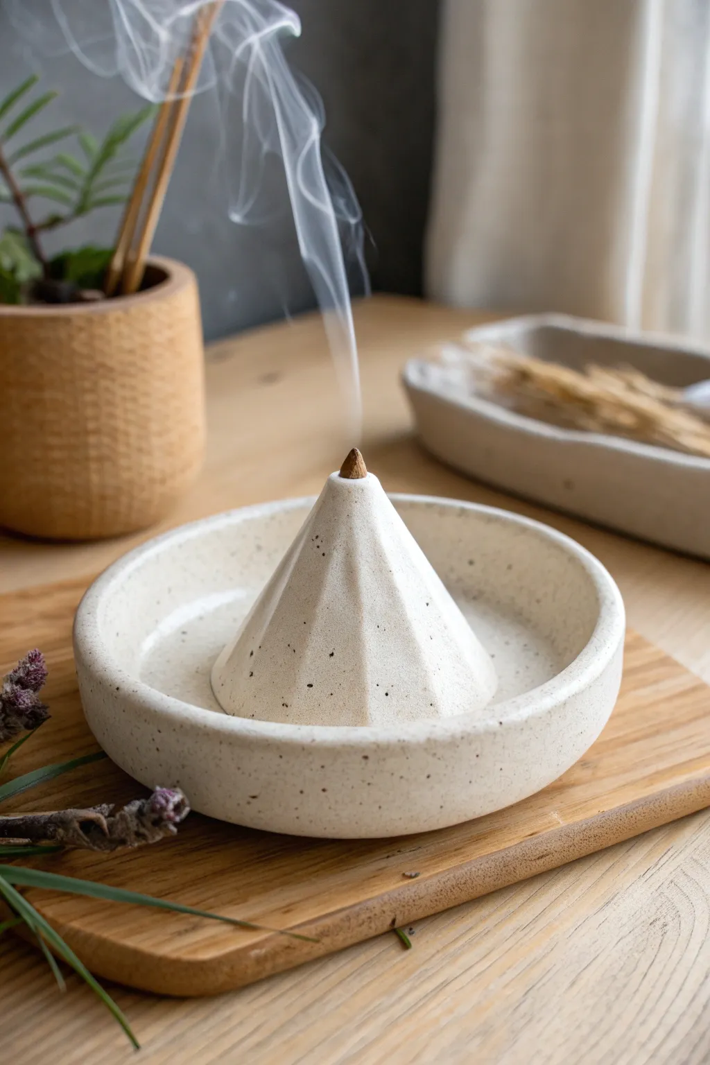 Minimal clay mountain backflow burner with cascading smoke, a calming boho Scandinavian accent.