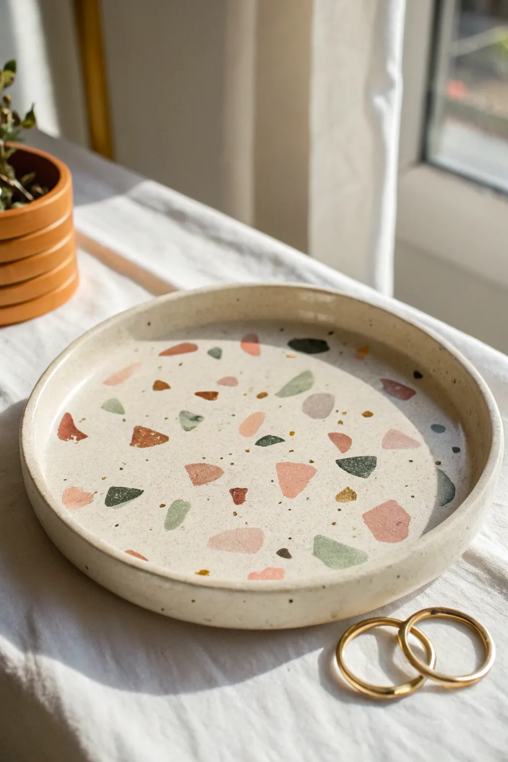 Terrazzo confetti air-dry clay plate with soft muted chips and a clean minimalist finish