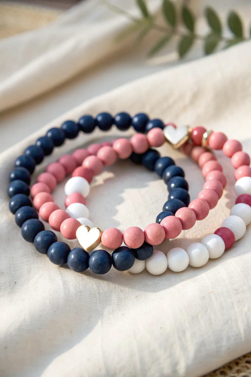 Bold two-tone split-heart clay beads paired with clean striped bracelets for a modern bundle