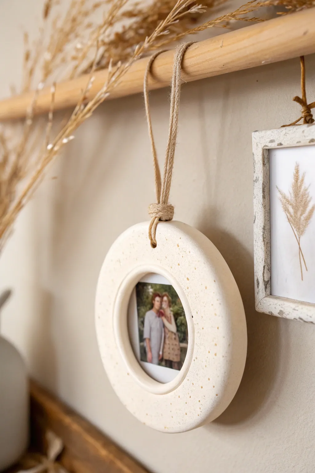 Round clay photo frame ornament with ribbon loop, a sweet minimalist keepsake to hang anywhere.