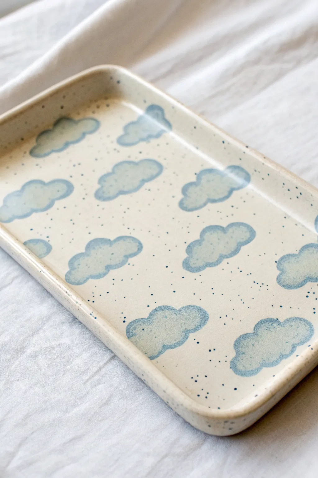 Dreamy cloud-painted ceramic tray in soft blues, bright airy minimal styling and handmade charm
