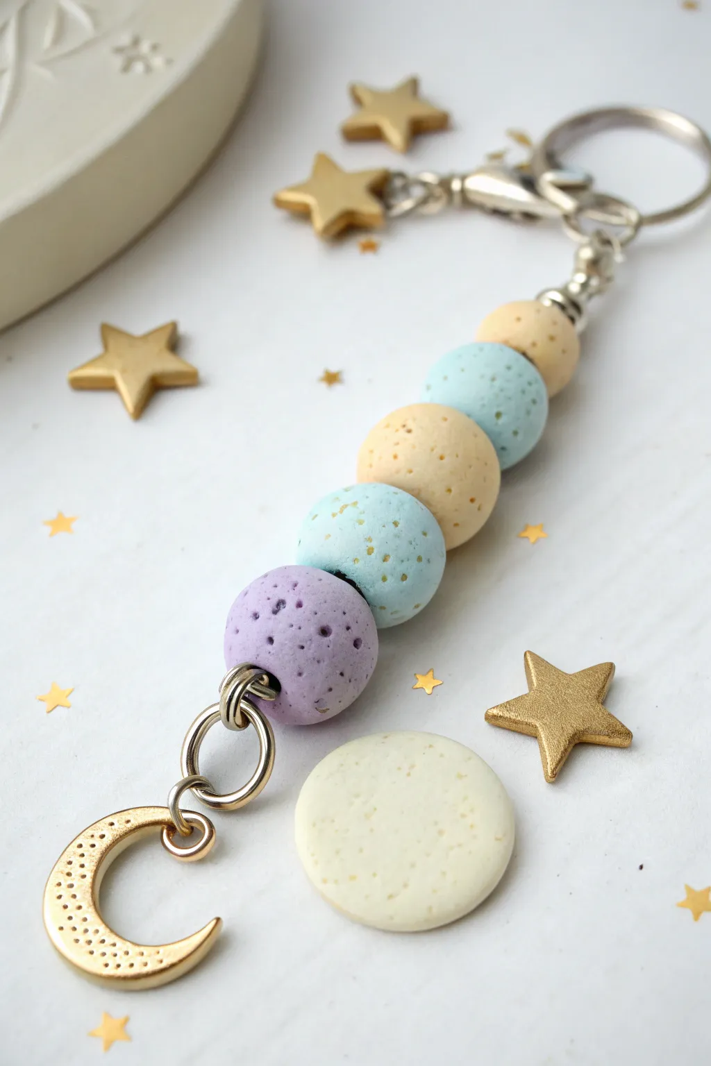 Pastel moon and star clay bead keychain in soft blues and lavender for a dreamy, cozy vibe