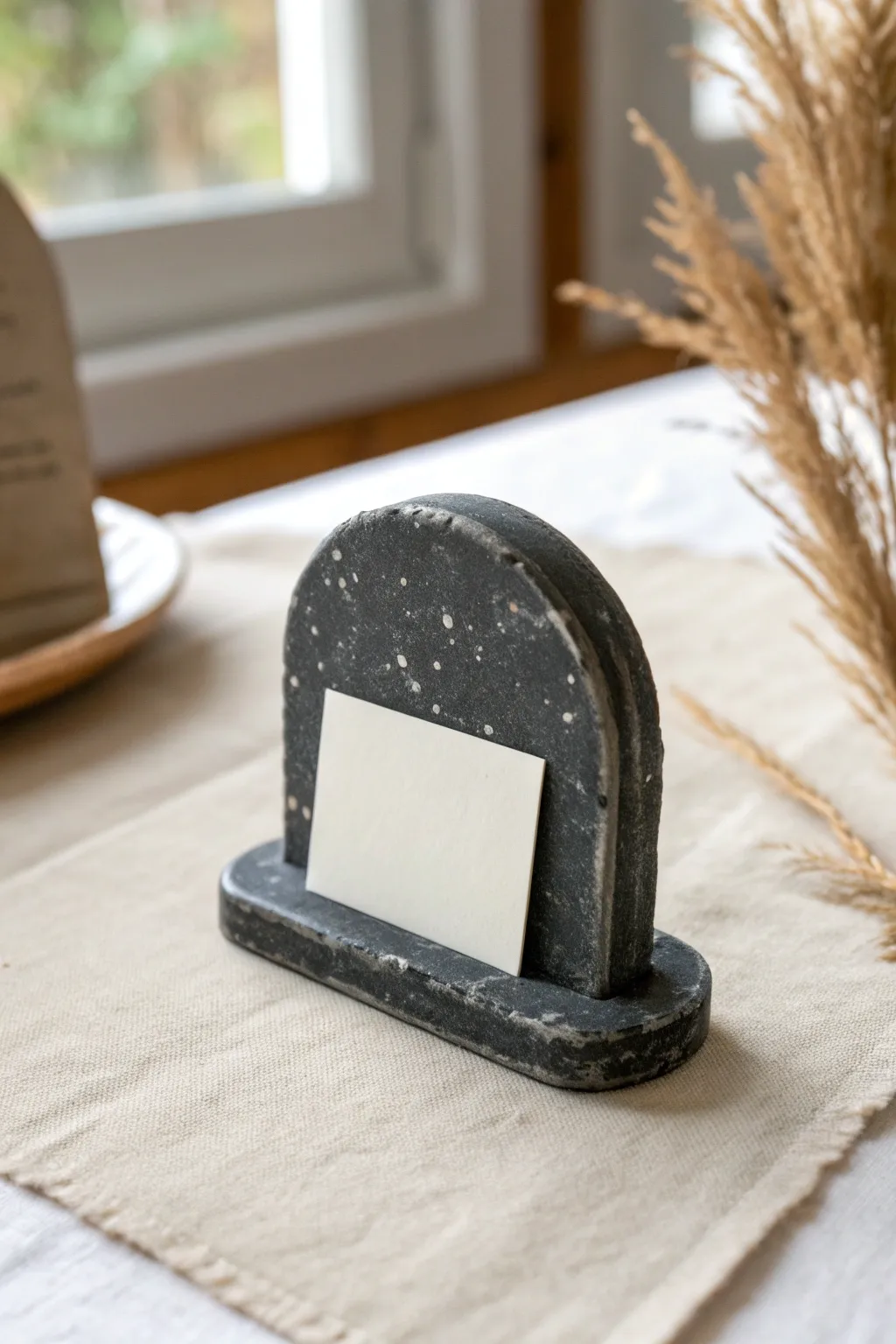 Minimal clay tombstone place card holder for a chic, spooky Halloween table setting